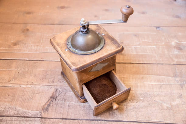 istock Hand Vintage coffee grinder with ground coffee inside 656421596