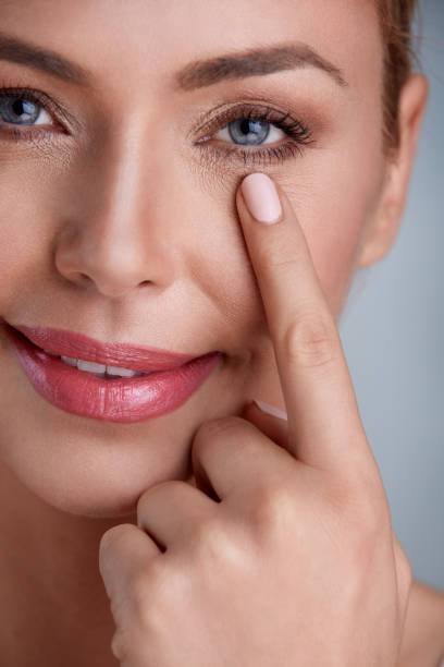 istock Woman checking wrinkles around the eyes 656423998