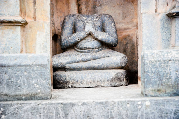 Old broken sculpture on a temple in Belur, Karnataka, India