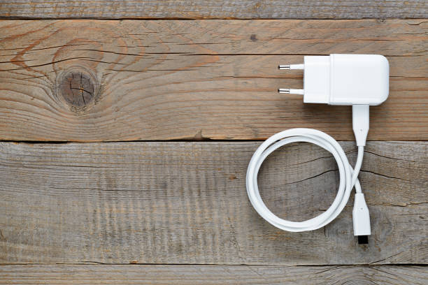 Charger for smartphone or tablet on wooden table