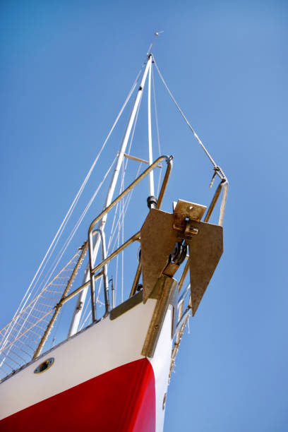 istock Bow of red and white sailboat, close up, low angle. 656431916