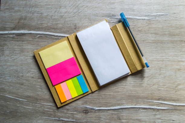 istock Pencil and note pad for note taking, sticky colored papers, colored sticky paper for taking notes, business man and notepad, business man and organizer, 656432188