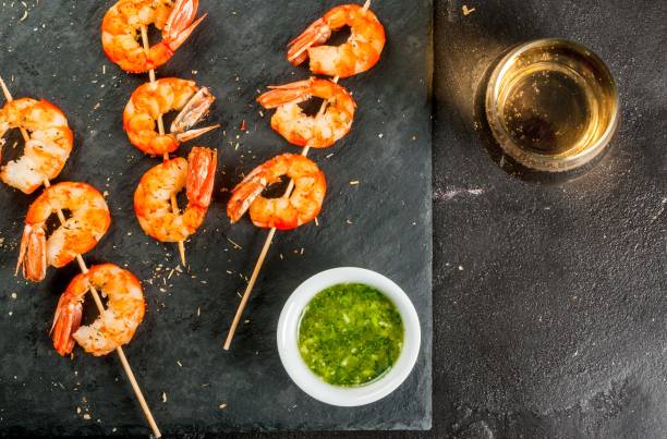 istock Fried grilled shrimp prawns with white wine 656435334