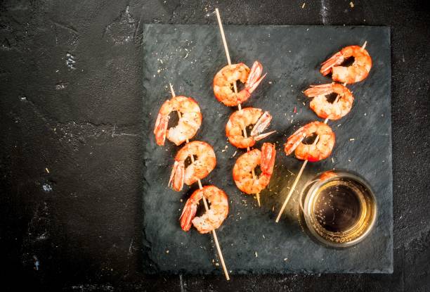 istock Fried grilled shrimp prawns with white wine 656435354