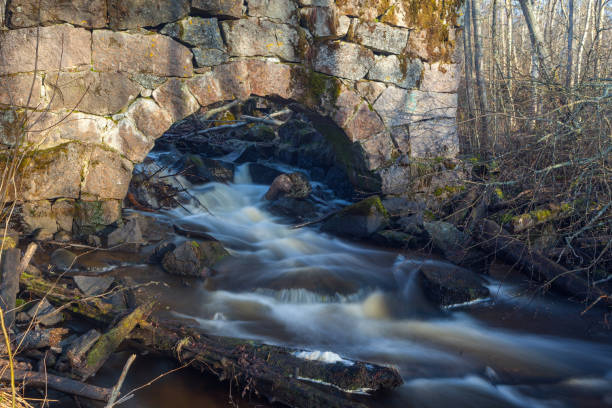 istock Old ruined mill on the river. 656438248