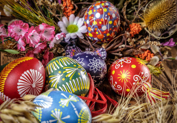 istock colored Easter eggs with wheat ears on the wooden background. Easter themed. Easter symbol. 656438334
