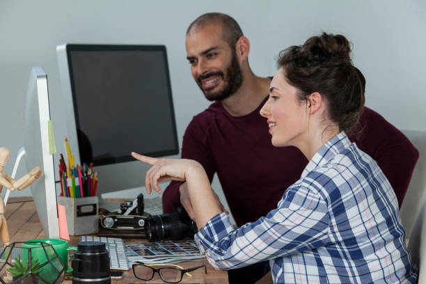 istock Photographers working at desk 656438390