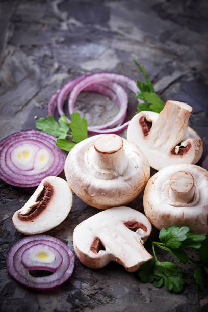 istock Fresh champignon mushrooms and red onion 656438580