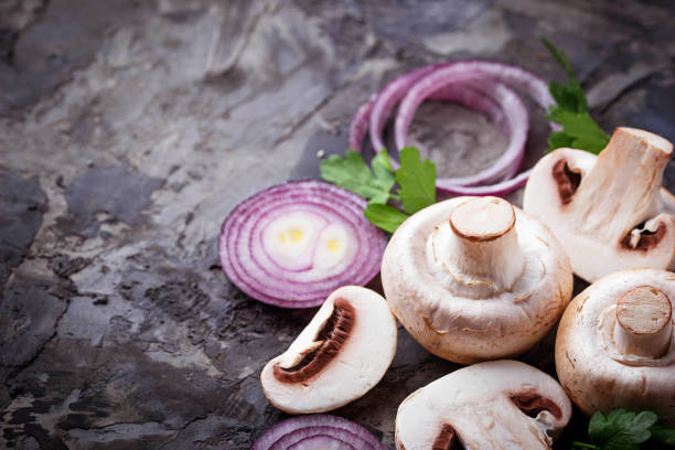 istock Fresh champignon mushrooms and red onion 656438606