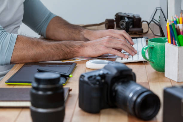 istock Photographers working at desk 656438738