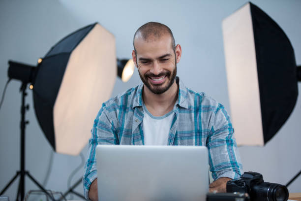 istock Photographer working over laptop 656438988