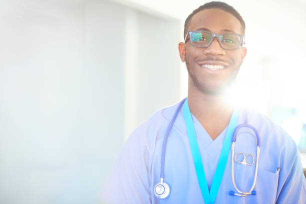 istock Smiling junior doctor in scrubs 656444256