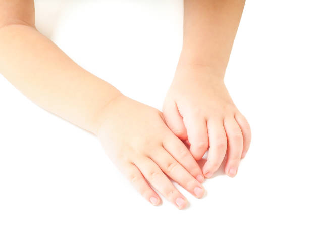 istock Toddler leaning towards on a white table, with hands together 656444366