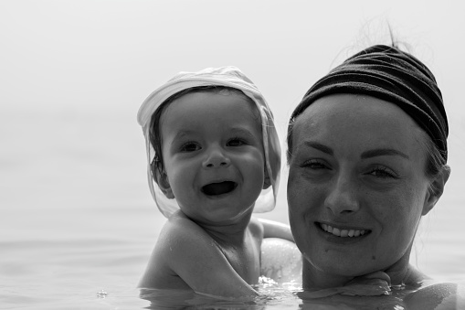 Mother and son play in the water