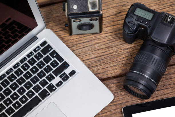 istock Close-up of laptop with cameras on table 656447224