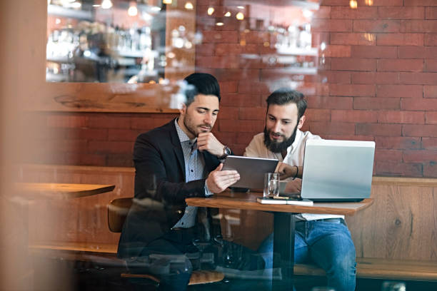 istock Businessmen talking in restaurant 656447356