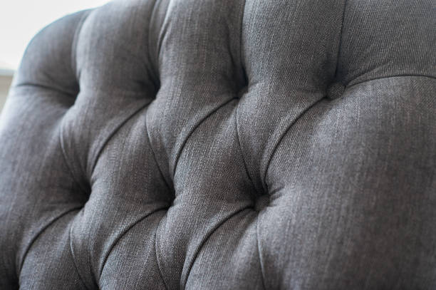 istock Seamless background texture close up of a grey sofa back with button detail on a thick cloth 656455680