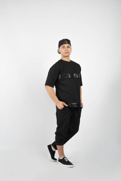 istock Young muscular man wearing black clothes and sneakers 656459580