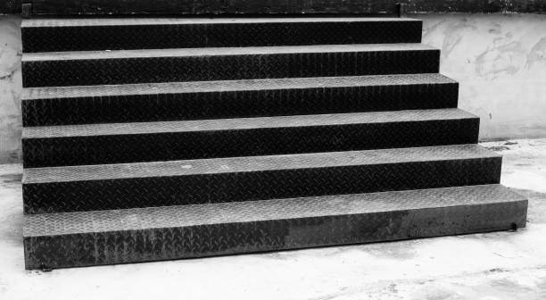 Stairs Steps The wide black stairs steps is on the ground. white stargazer stock pictures, royalty-free photos & images