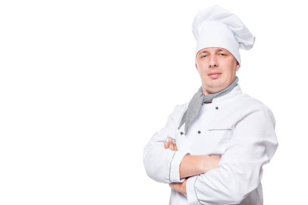 istock chef in uniform and a white space on the left background 656464264