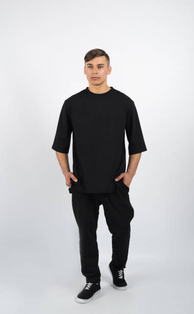 istock Young muscular man wearing black clothes and sneakers 656466566
