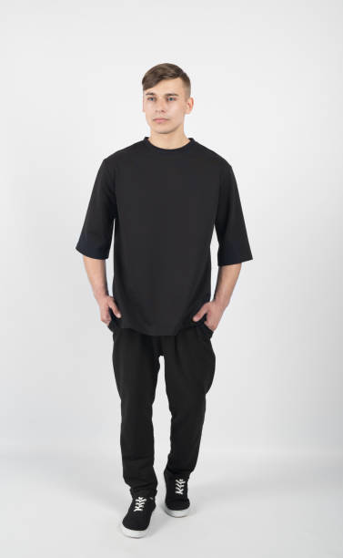 istock Young muscular man wearing black clothes and sneakers 656466596