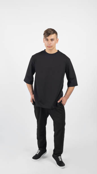 istock Young muscular man wearing black clothes and sneakers 656466622