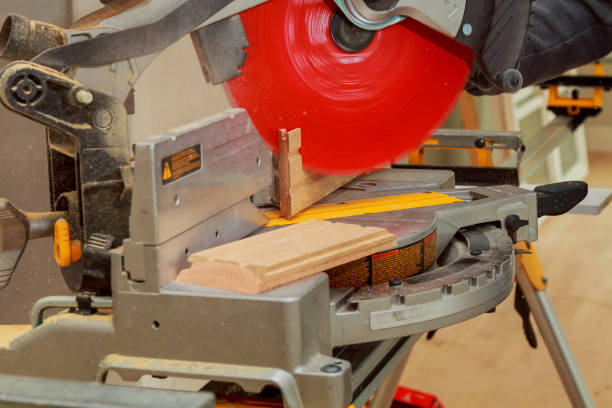istock man cutting wood on electric saw 656470524