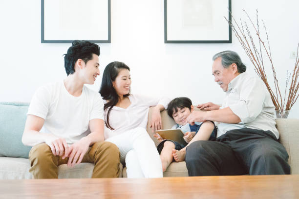 istock Multi-generation family relaxing in living room 656473230