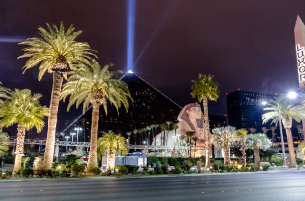 Luxor Hotel and Casino and Sky Beam at night - Las Vegas, Nevada, USA Las Vegas, Nevada, USA - December, 2016: Luxor Hotel and Casino and Sky Beam at night las vegas metropolitan area luxor luxor hotel pyramid stock pictures, royalty-free photos & images