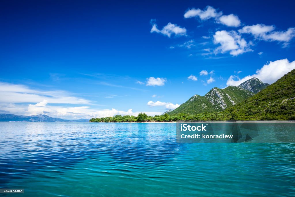 Idyllic seascape - Island, crystal clear Adriatic Sea and Blue Sky with White Clouds Sea Stock Photo