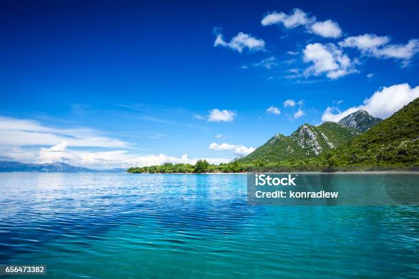 Idyllic Seascape Island Crystal Clear Adriatic Sea And Blue Sky With White Clouds Stock Photo - Download Image Now