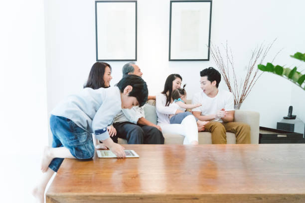 istock Multi-generation family relaxing in living room 656475780