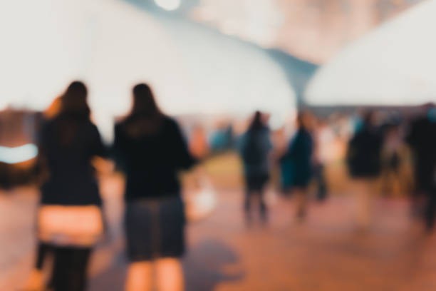 istock Abstract bokeh background of people walk at the park on night 656476232