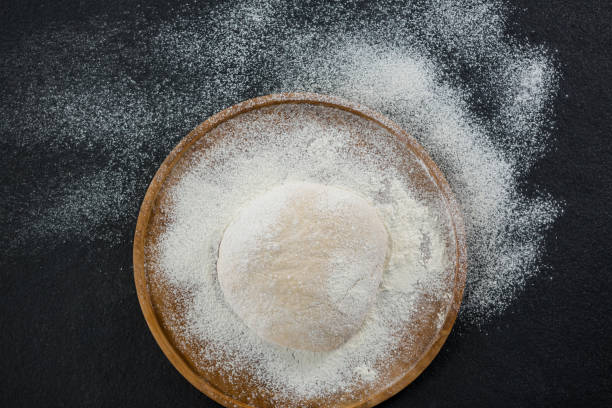 istock Pizza dough ball on a wooden tray 656480578
