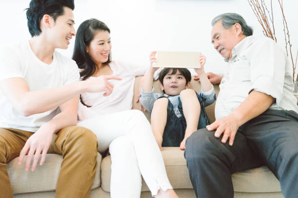 istock Multi-generation family relaxing in living room 656483210