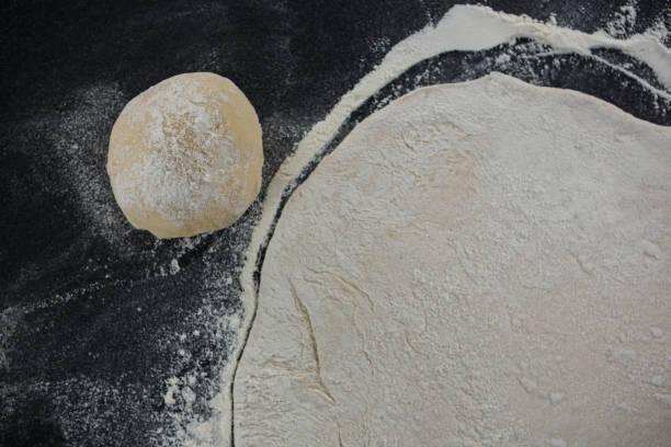 istock Pizza dough ball and flour 656483322