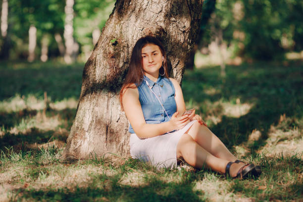 istock girl with phone 656483928