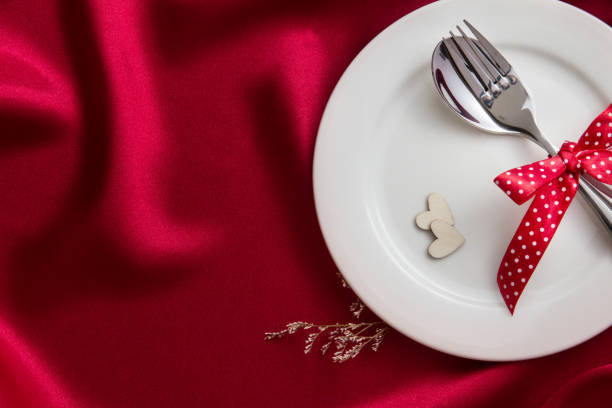 istock wooden heart shape with White empty plate 656484316