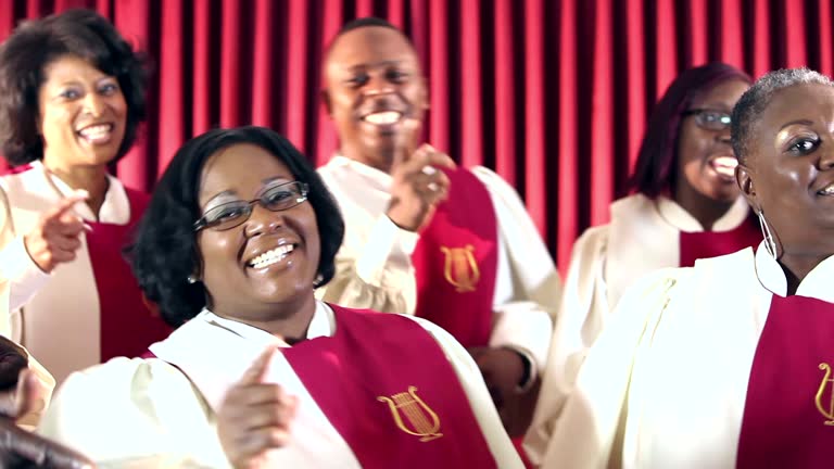 Group of black men and women singing in church choir