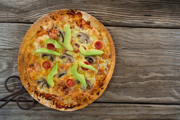 istock Italian pizza on a wooden plank 656487252