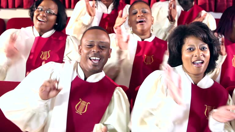 Group of black men and women singing in church choir