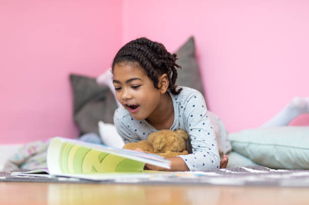 istock Young girl reads in her bedroom 656489620
