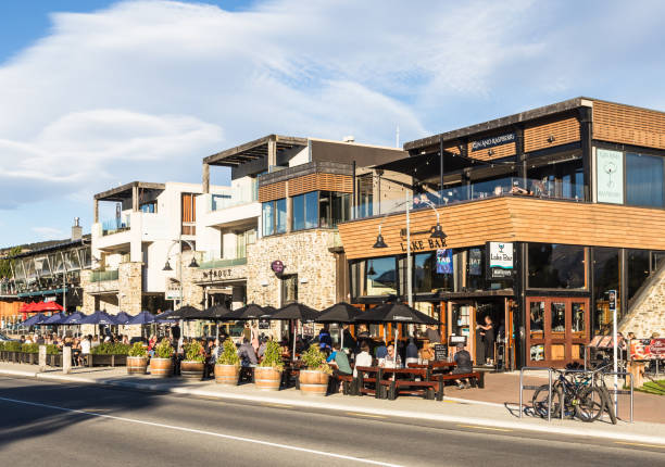 Sidewalk bar and restaurants in Wanaka lakefront in New Zealand stock photo