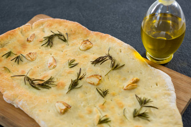 istock Italian pizza with olive oil on a chopping board 656493538