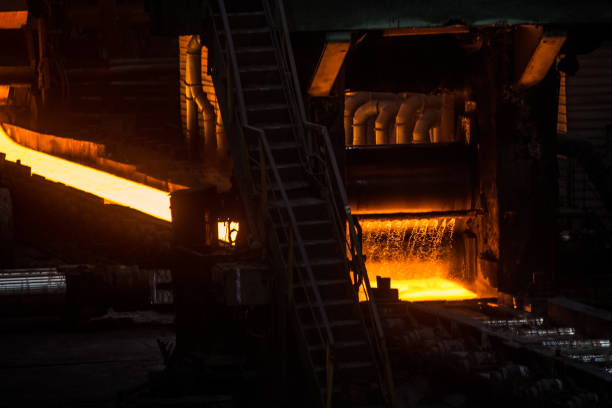 Sheet of hot metal on the conveyor belt Steel mill. The production process in the rolling mill. Sheet of hot metal on the conveyor belt. Furnace stock pictures, royalty-free photos & images
