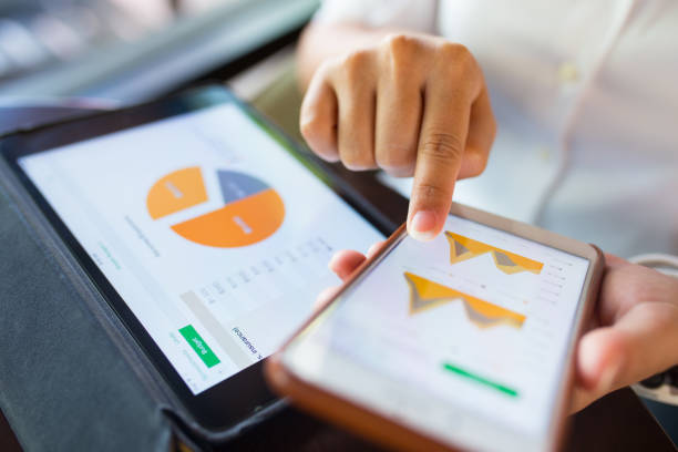 istock Businesswoman check data in smartphone and tablet 656500348
