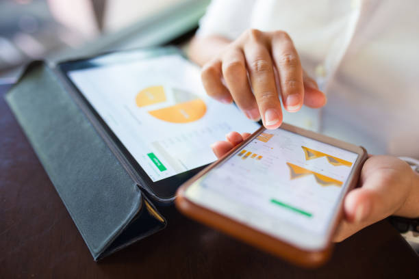 istock Businesswoman check data in smartphone and tablet 656500368