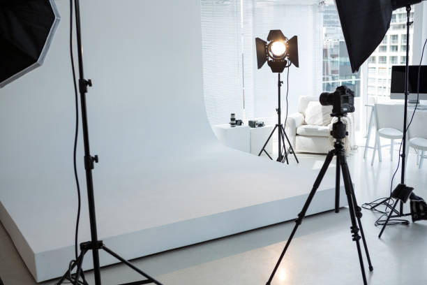istock Photo studio with tripod, lighting equipment and digital camera 656500936