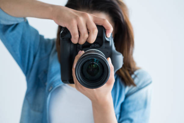 istock Female photographer with digital camera 656508428